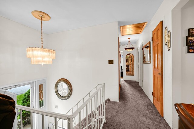 10 Catawba Dr, West Nyack, NY 10994 - corridor featuring carpet, an upstairs landing, and a chandelier