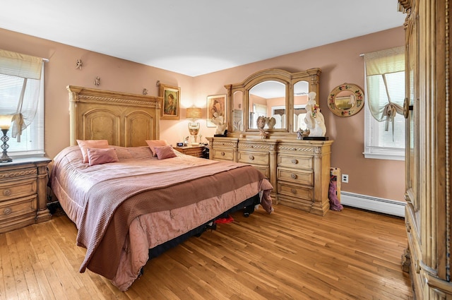 10 Catawba Dr, West Nyack, NY 10994 - bedroom featuring baseboard heating and light wood-style flooring