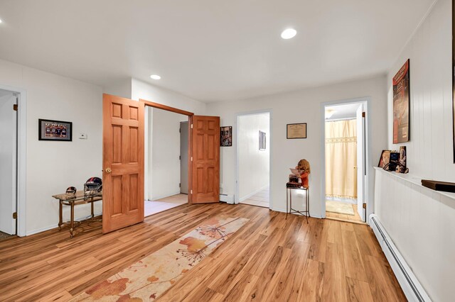 10 Catawba Dr, West Nyack, NY 10994 - unfurnished bedroom featuring a baseboard radiator, light wood-type flooring, recessed lighting, and baseboards