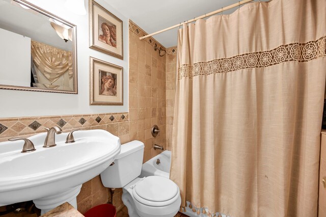 10 Catawba Dr, West Nyack, NY 10994 - bathroom with tile walls, a sink, toilet, and shower / tub combo with curtain