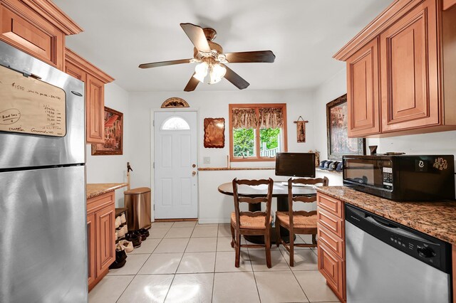 10 Catawba Dr, West Nyack, NY 10994 - kitchen with stainless steel appliances, brown cabinetry, an office area, a ceiling fan, and light tile patterned flooring