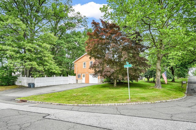 10 Catawba Dr, West Nyack, NY 10994 - obstructed view of property featuring asphalt driveway and an attached garage