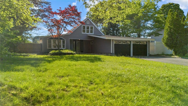 28 Snowberry Ln, Islandia, NY 11749 - view of front of home featuring asphalt driveway and an attached garage