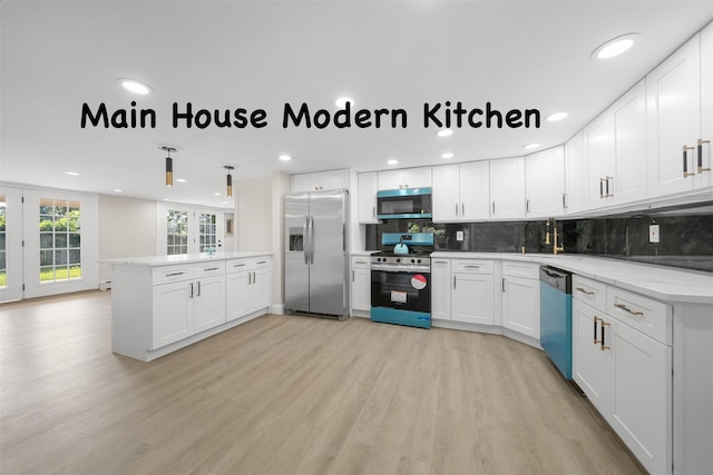 28 Snowberry Ln, Islandia, NY 11749 - kitchen with stainless steel appliances, light wood finished floors, backsplash, white cabinetry, and recessed lighting