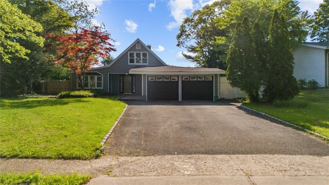 28 Snowberry Ln, Islandia, NY 11749 - view of front of property featuring a garage and driveway
