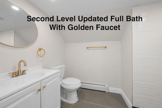 28 Snowberry Ln, Islandia, NY 11749 - bathroom featuring a baseboard radiator, vanity, vaulted ceiling, and tile patterned floors
