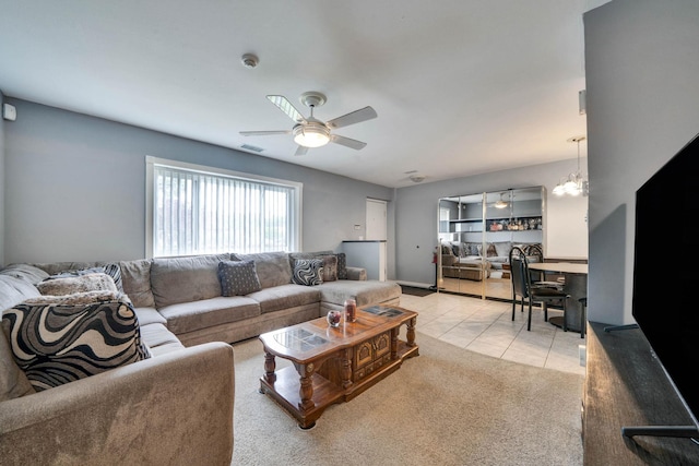 74 Gauguin Ct Unit 74, Middle Island, NY 11953 - carpeted living room featuring ceiling fan, tile patterned floors, and a chandelier
