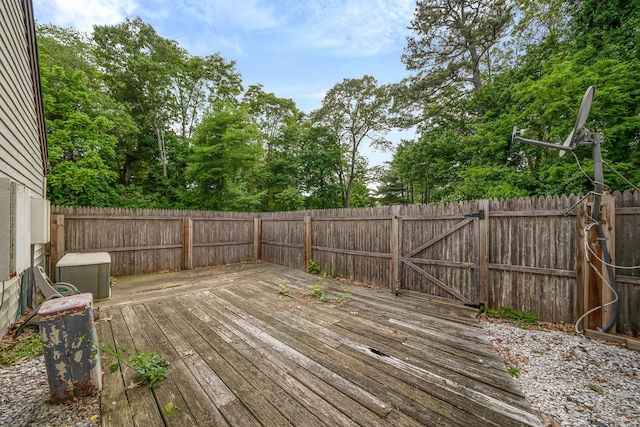 74 Gauguin Ct Unit 74, Middle Island, NY 11953 - wooden deck with a fenced backyard