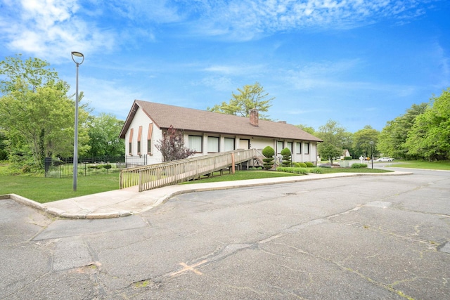 74 Gauguin Ct Unit 74, Middle Island, NY 11953 - view of front facade featuring a chimney