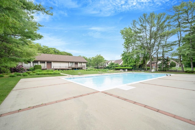 74 Gauguin Ct Unit 74, Middle Island, NY 11953 - swimming pool featuring a patio area and a lawn