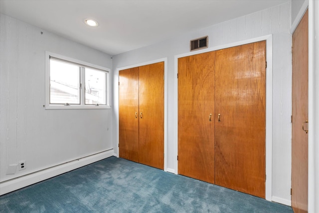 2917 Frankel Blvd, Merrick, NY 11566 - unfurnished bedroom with multiple closets, carpet floors, a baseboard radiator, and recessed lighting