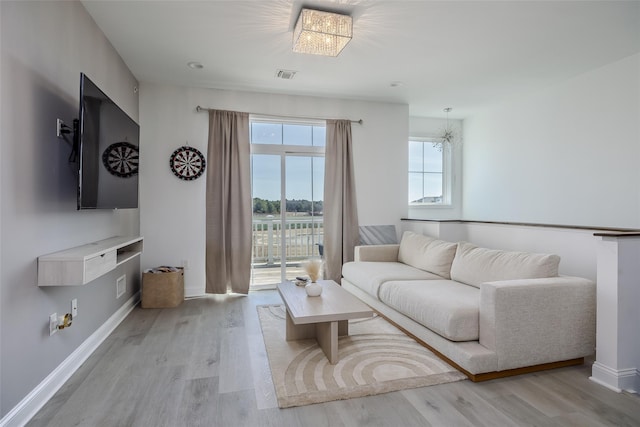 12 Grace Hall Ln, Yaphank, NY 11980 - living area featuring light wood-style flooring and baseboards