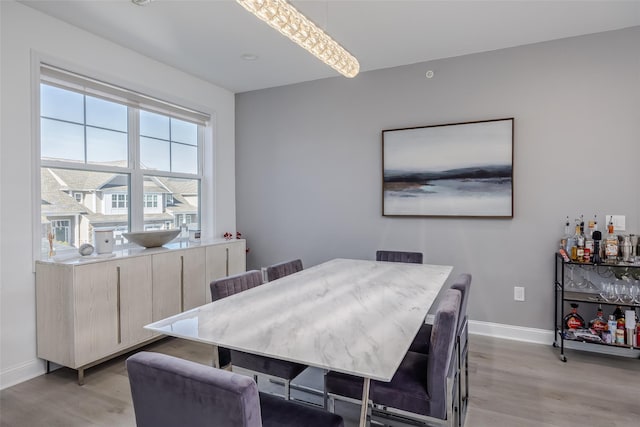 12 Grace Hall Ln, Yaphank, NY 11980 - dining room featuring light wood-style flooring and baseboards