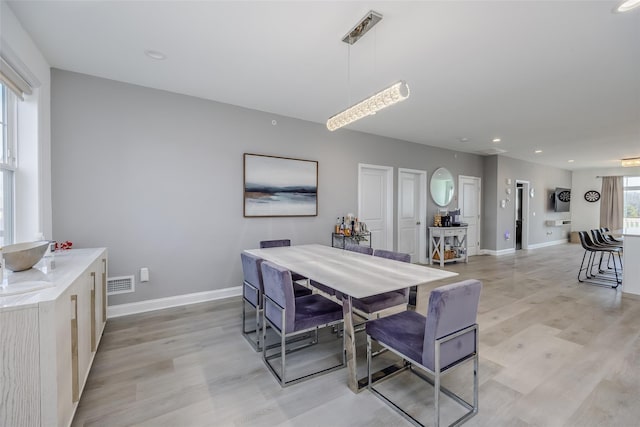 12 Grace Hall Ln, Yaphank, NY 11980 - dining room featuring light wood-style flooring, baseboards, and recessed lighting