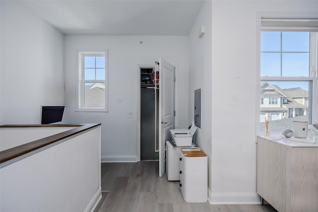 12 Grace Hall Ln, Yaphank, NY 11980 - office with baseboards, light wood finished floors, and electric panel