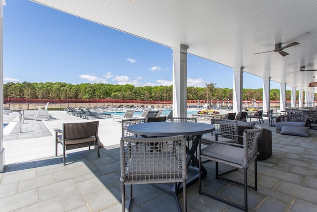 12 Grace Hall Ln, Yaphank, NY 11980 - view of patio / terrace featuring a community pool and a ceiling fan