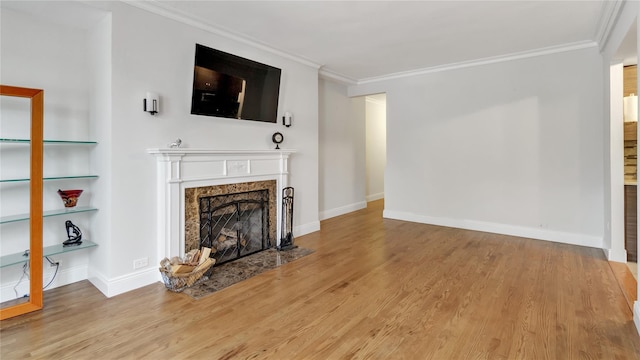 8 Barstow Rd Unit 2G, Great Neck, NY 11021 - living area with a premium fireplace, ornamental molding, wood finished floors, baseboards, and built in features