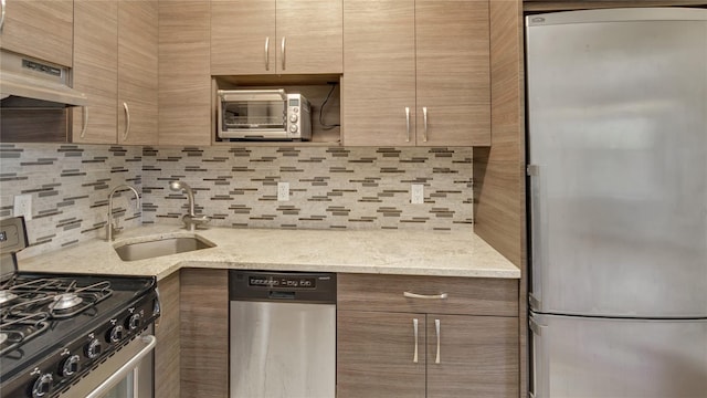 8 Barstow Rd Unit 2G, Great Neck, NY 11021 - kitchen with appliances with stainless steel finishes, a sink, under cabinet range hood, backsplash, and modern cabinets