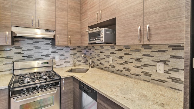8 Barstow Rd Unit 2G, Great Neck, NY 11021 - kitchen with appliances with stainless steel finishes, under cabinet range hood, a sink, tasteful backsplash, and light stone countertops