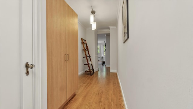 8 Barstow Rd Unit 2G, Great Neck, NY 11021 - hall featuring crown molding, light wood-type flooring, and baseboards
