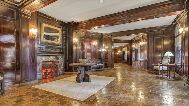 8 Barstow Rd Unit 2G, Great Neck, NY 11021 - lobby featuring wood walls, a decorative wall, and ornamental molding