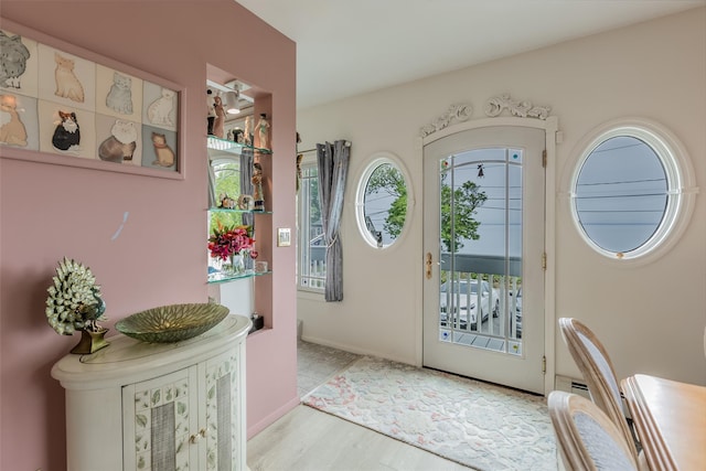 26 Point Breeze Dr, Rocky Point, NY 11778 - entryway featuring wood finished floors and baseboards