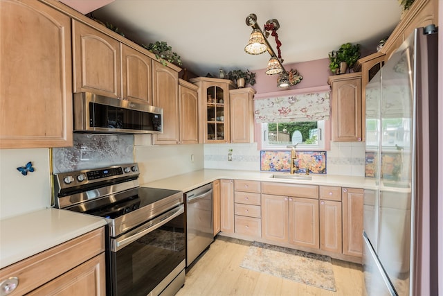 26 Point Breeze Dr, Rocky Point, NY 11778 - kitchen with stainless steel appliances, a sink, light countertops, and tasteful backsplash
