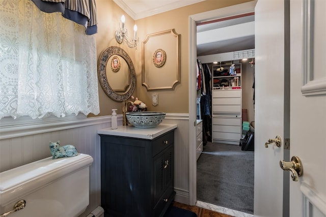 26 Point Breeze Dr, Rocky Point, NY 11778 - bathroom featuring toilet, vanity, wainscoting, and ornamental molding