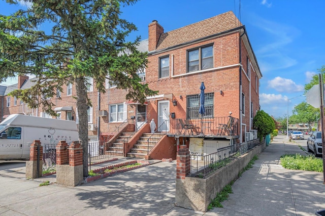 14627 Reeves Ave, Flushing, NY 11367 - multi unit property featuring brick siding, a chimney, and concrete driveway