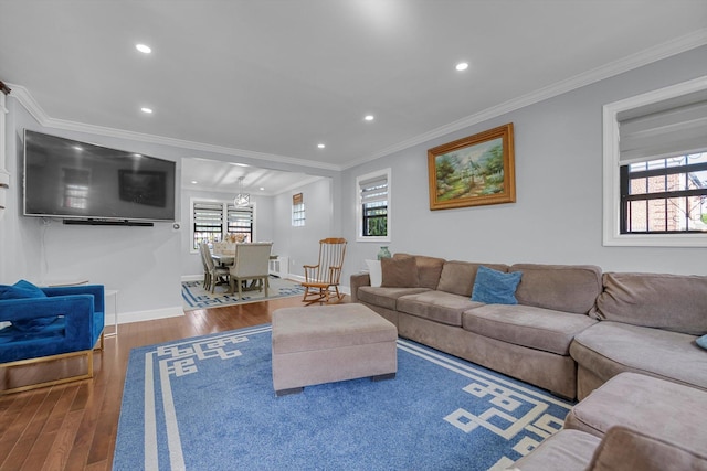 14627 Reeves Ave, Flushing, NY 11367 - living room featuring wood finished floors, plenty of natural light, recessed lighting, crown molding, and baseboards