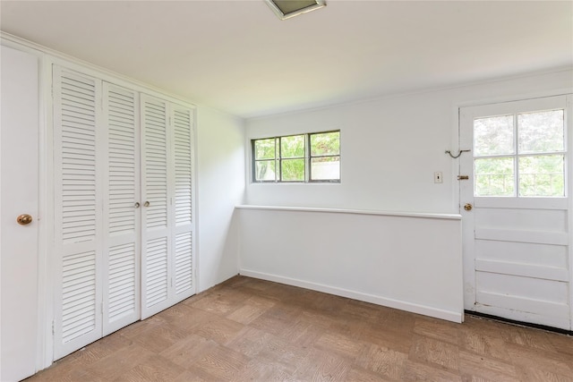 233 Violet St, Massapequa Park, NY 11762 - unfurnished bedroom featuring a closet and baseboards