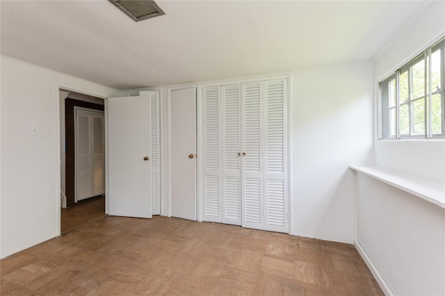 233 Violet St, Massapequa Park, NY 11762 - unfurnished bedroom featuring a closet
