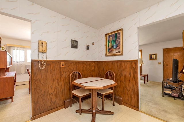1649 Falmouth Ave, New Hyde Park, NY 11040 - dining area with wallpapered walls, light carpet, and baseboard heating