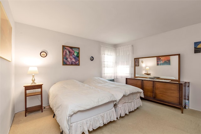 1649 Falmouth Ave, New Hyde Park, NY 11040 - bedroom with light colored carpet and baseboards