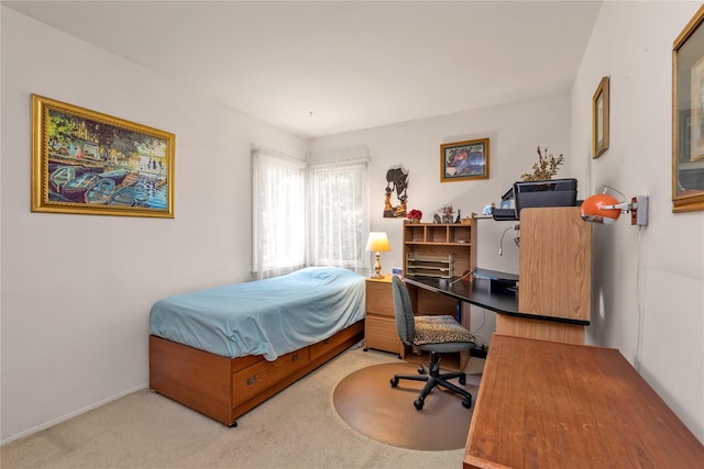1649 Falmouth Ave, New Hyde Park, NY 11040 - bedroom featuring a desk, light colored carpet, and baseboards