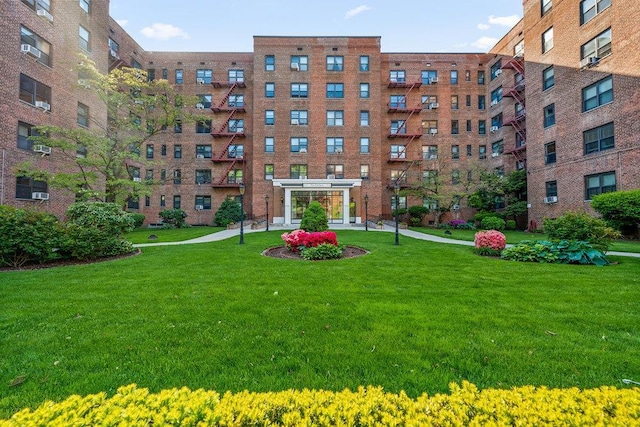 100-11 67th Rd Unit 505, Forest Hills, NY 11375 - surrounding community with a lawn