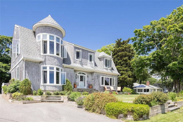 2335 Minnehaha Blvd, Southold, NY 11971 - view of front facade featuring roof with shingles and a gambrel roof