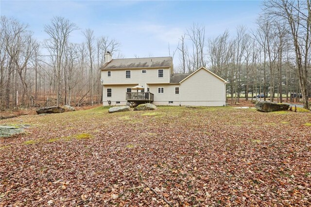 68 Cauthers Ln, Woodridge, NY 12789 - rear view of property featuring a wooden deck and a chimney