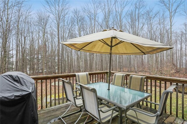68 Cauthers Ln, Woodridge, NY 12789 - deck with outdoor dining area and a grill