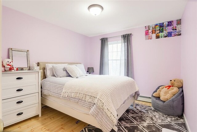 68 Cauthers Ln, Woodridge, NY 12789 - bedroom featuring a baseboard radiator and light wood-style floors