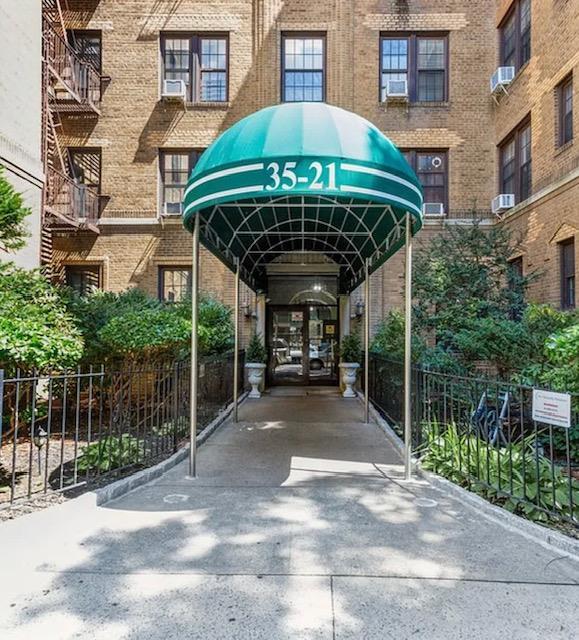 35-21 81st St Unit 5C, Jackson Heights, NY 11372 - view of parking / parking lot with concrete driveway