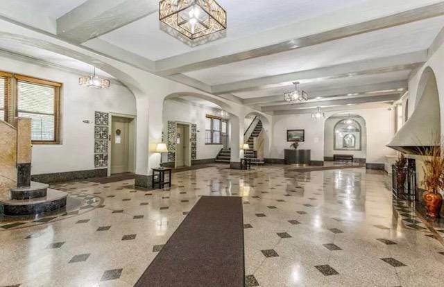 35-21 81st St Unit 5C, Jackson Heights, NY 11372 - common area featuring beamed ceiling and stairway