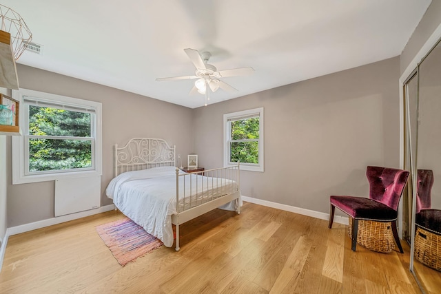 25 Rustic Gate Ln, Dix Hills, NY 11746 - bedroom with light wood-type flooring, baseboards, a closet, and ceiling fan