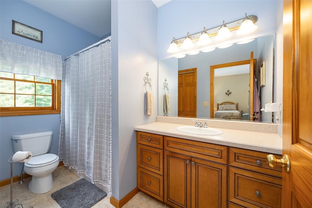 23 Saddle Rock Dr, Poughkeepsie, NY 12603 - ensuite bathroom featuring vanity, toilet, tile patterned floors, and baseboards