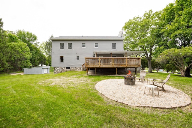 23 Saddle Rock Dr, Poughkeepsie, NY 12603 - rear view of property featuring an outdoor fire pit, a wooden deck, a lawn, and a chimney