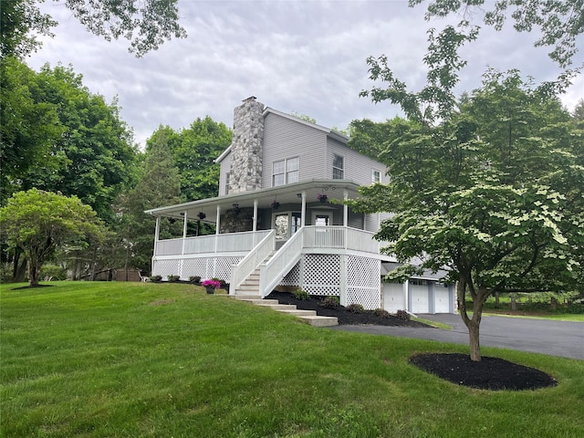 23 Saddle Rock Dr, Poughkeepsie, NY 12603 - view of front of property featuring a front lawn, asphalt driveway, a porch, stairs, and a chimney