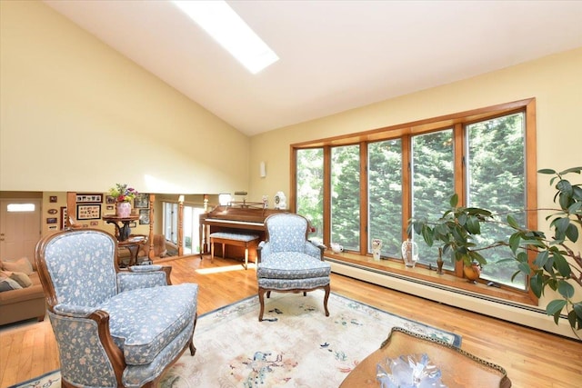 2783 Rita Ct, Bellmore, NY 11710 - living area with baseboard heating, wood finished floors, healthy amount of natural light, and high vaulted ceiling