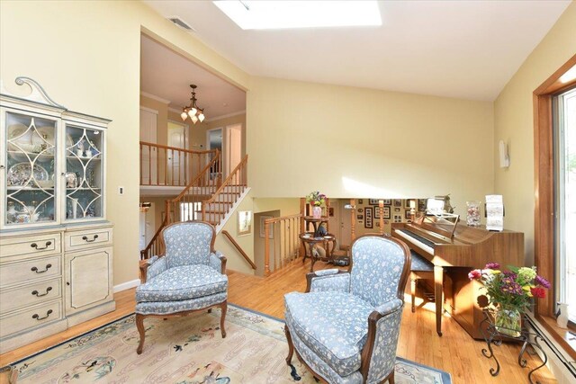 2783 Rita Ct, Bellmore, NY 11710 - sitting room featuring wood finished floors, a chandelier, and stairway