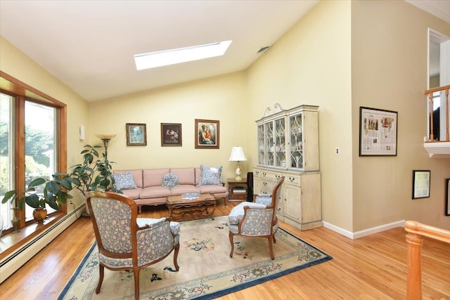 2783 Rita Ct, Bellmore, NY 11710 - living room featuring baseboard heating, wood finished floors, a skylight, baseboards, and high vaulted ceiling
