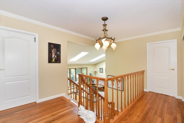 2783 Rita Ct, Bellmore, NY 11710 - stairway with wood finished floors, baseboards, crown molding, and a chandelier